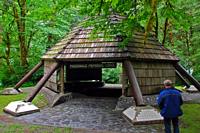 There is a cool lodge with picnic tables and a big fire pit.